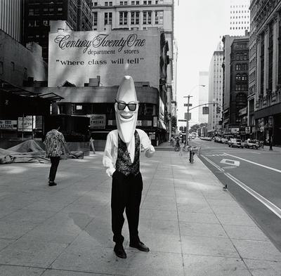[man wearing smiling moon mask]