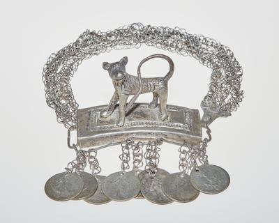 Bracelet with animal ornament and coin pendants