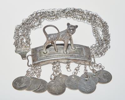 Bracelet with animal ornament and coin pendants