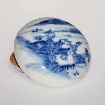 Seal paste box with blue and white underglaze depicting a landscape scene