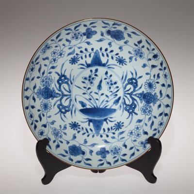 Dish with blue and white underglaze depicting floral designs