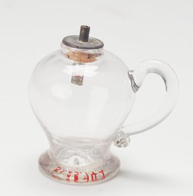 Candle holder with candle attachment