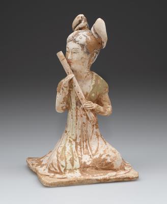 Tomb figure of a musician playing a bamboo flute